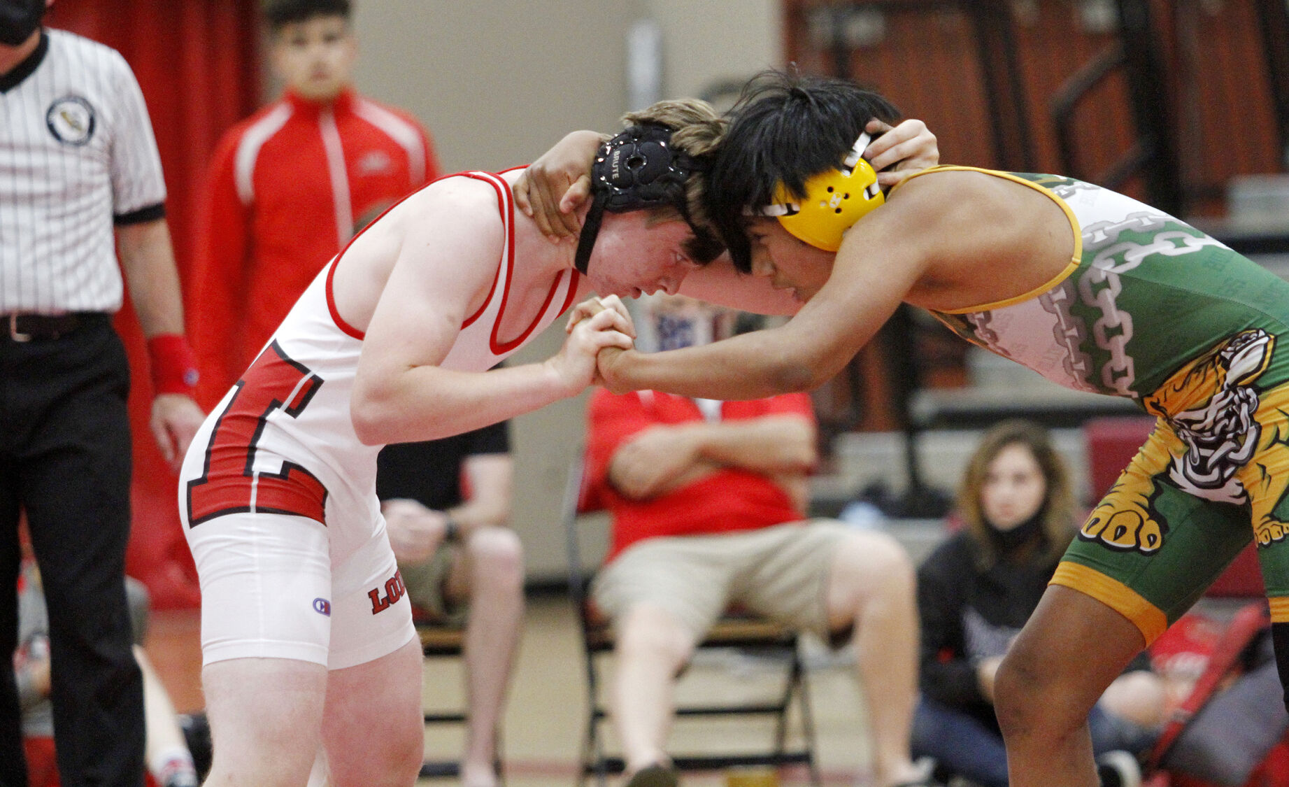 High school roundup: Flames’ boys and girls wrestlers take down Bulldogs